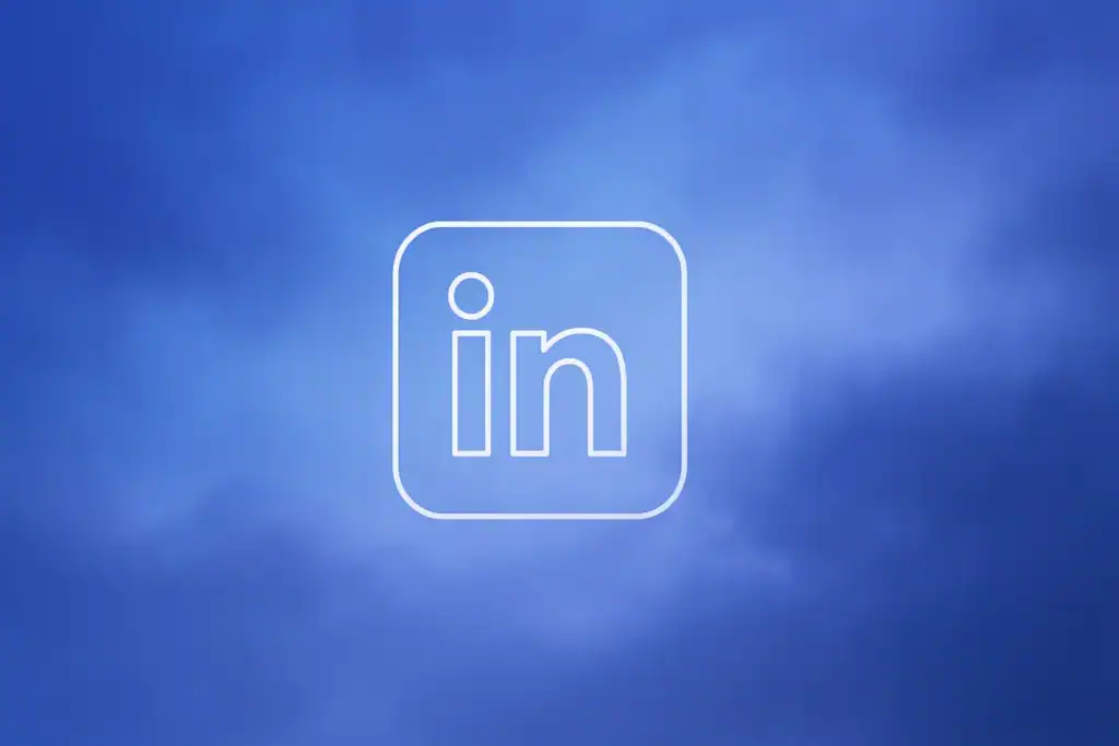 **Style E - Centered Icon Minimal:** "LinkedIn Automation Tool That Actually Works | 2026 Guide - 2560x1440px, single large white LinkedIn icon centered (minimalistic line art style), soft cloudy gradient blending #3657D5 royal blue, light periwinkle, pale azure, and deep navy, dreamy atmospheric aesthetic, 80px padding from all sides, NOT transparent, clean abstract composition --ar 16:9"